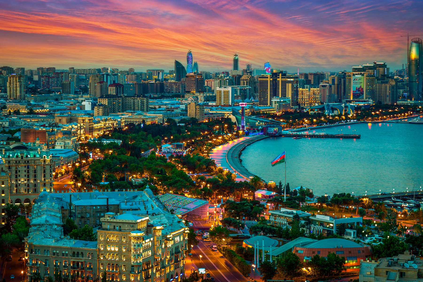 Baku at dusk — The capital, seen from the hills above the bay